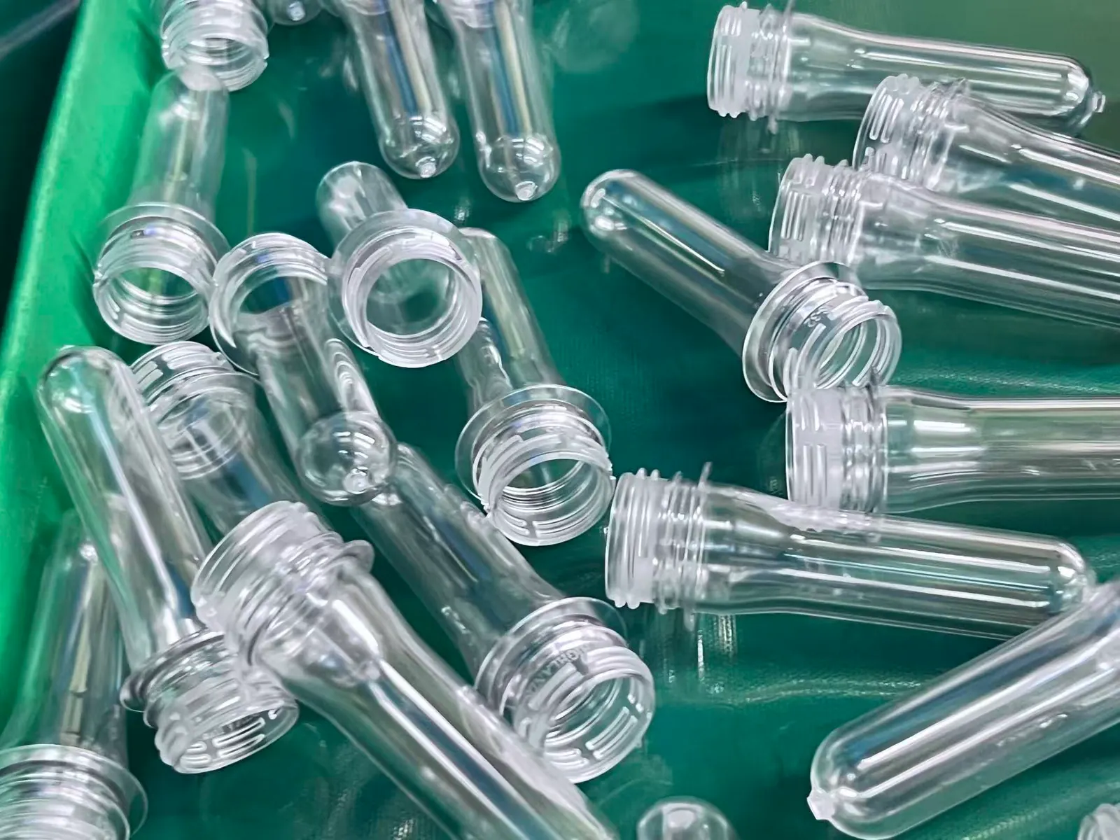 Clear PET preform trial samples prepared for water bottle project inspection